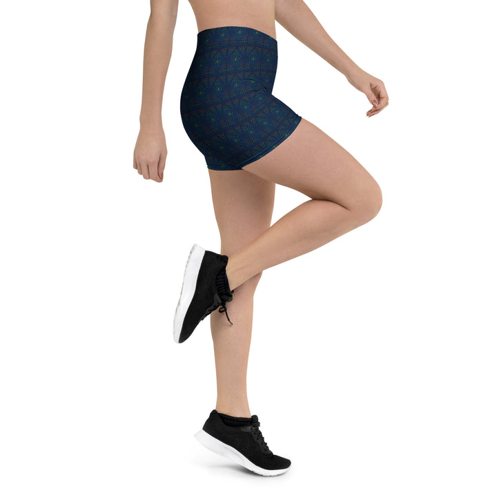 Action shot with leg raised – showcasing comfort and style in GeOm sacred geometry shorts.