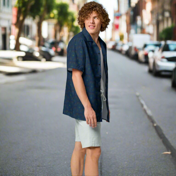 Person wearing a navy blue shirt and light gray shorts on a white background