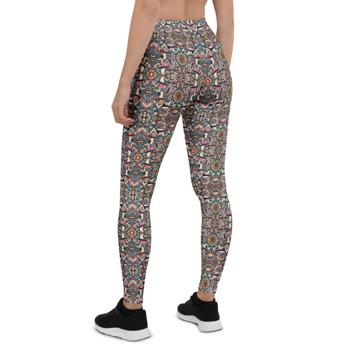 Back view of MushTribe leggings – fusion of psychedelic mushrooms and tribal art for yoga and festival wear.