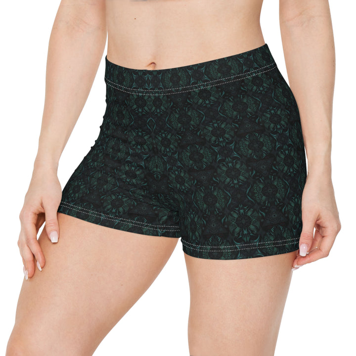 Close-up front detail of Lumora shorts leggings – vibrant psychedelic pattern with cosmic energy.