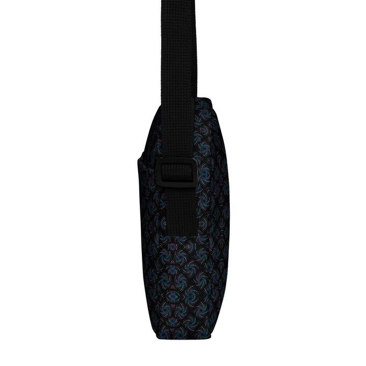 Left view of Dotadelic BlackBlue crossbody – compact psychedelic bag for rave and festival fashion