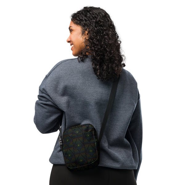 Person wearing GeOm Black psychedelic crossbody bag – sacred geometry style for festivals and travel