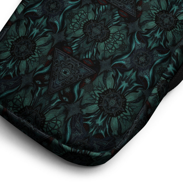 Close-up of Lumora bag fabric – sacred geometry print in vivid colors on dark background
