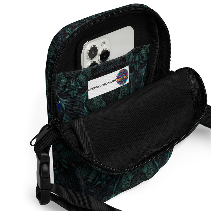 Interior of Lumora bag with phone and essentials – practical psychedelic crossbody for events
