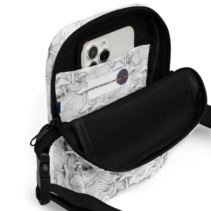 Interior of Mushforest bag with phone and essentials – practical psychedelic crossbody for events