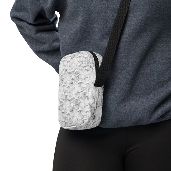 Mushforest crossbody bag worn on the side – tribal psychedelic design for rave and visionary streetwear