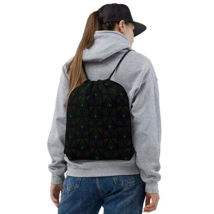 Model wearing GeOm Black psychedelic drawstring bag – perfect for festivals, raves, and visionary flow