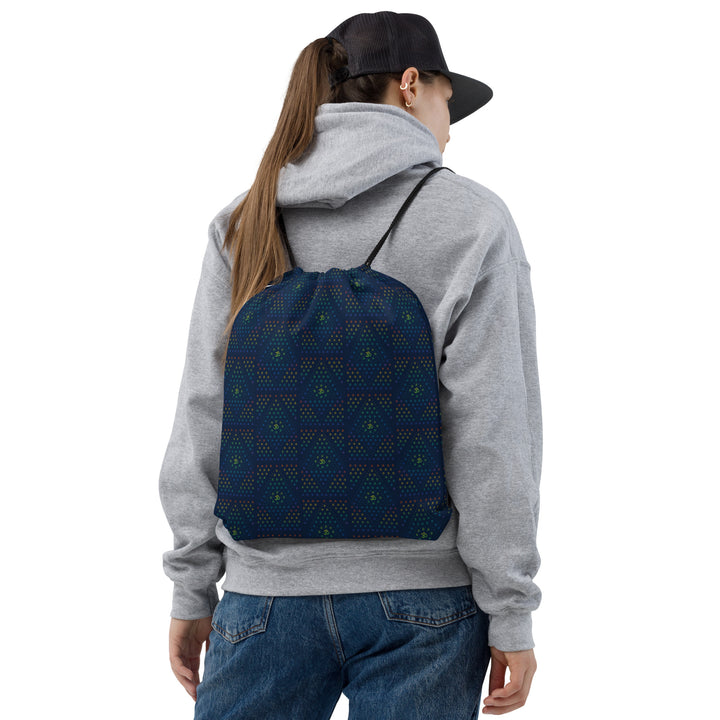 Model wearing GeOm Blue psychedelic drawstring bag – perfect for festivals, raves, and visionary flow