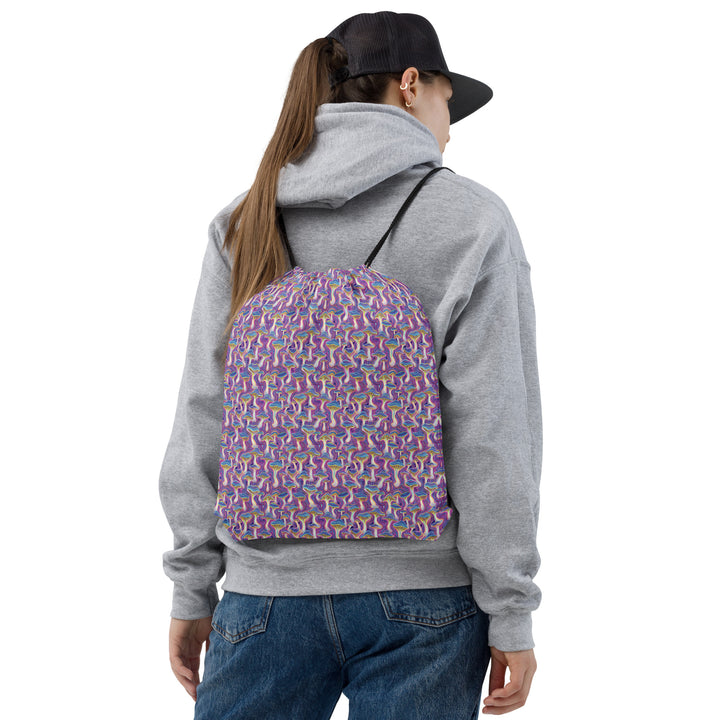 Rave model wearing MushTrip psychedelic drawstring bag – visionary fashion for festivals
